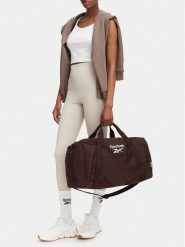 Reebok Torba sportowa CWBEO-RBK-B-001-08 Brązowy ciemny. Brązowe torby podróżne damskie Reebok, bez wzorów, z materiału. Za 129.99 zł.