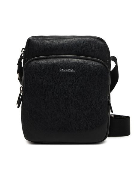 Calvin Klein Saszetka Raised Pocket Reporter LV04D3317G Czarny. Czarne saszetki męskie CALVIN KLEIN, ze skóry. Za 409.99 zł.