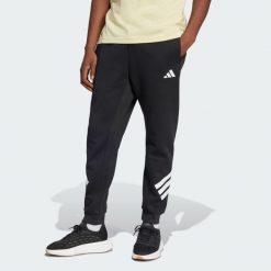 Spodnie Future Icons z 3 paskami. Czarne spodnie materiałowe męskie Adidas, bez wzorów, z bawełny, klasyczne, z standardowym stanem. Za 299.35 zł.