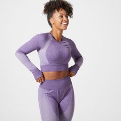Koszulka fitness damska Domyos długi rękaw. Fioletowe bluzki sportowe damskie DOMYOS, l, bez wzorów, z materiału, bez ramiączek. W wyprzedaży za 69.99 zł.