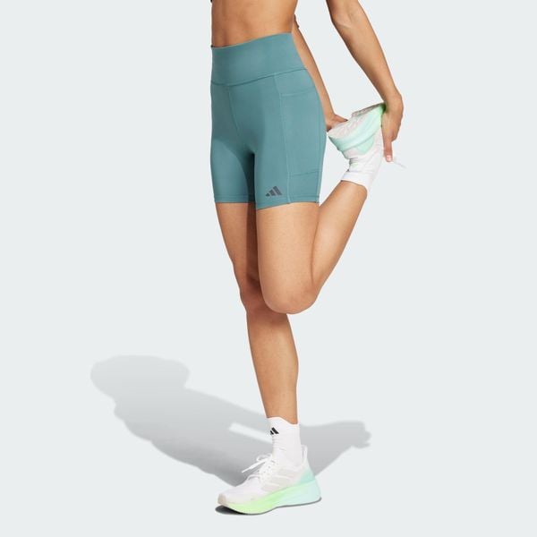 Legginsy Own the Run Short. Niebieskie legginsy damskie Adidas, bez wzorów, z materiału. W wyprzedaży za 164.25 zł.
