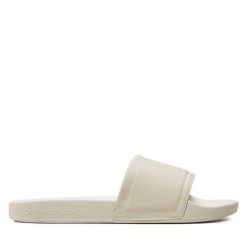 Klapki Calvin Klein Jeans. Białe klapki damskie Calvin Klein Jeans, bez wzorów, z jeansu, bez obcasa. Za 179.99 zł.