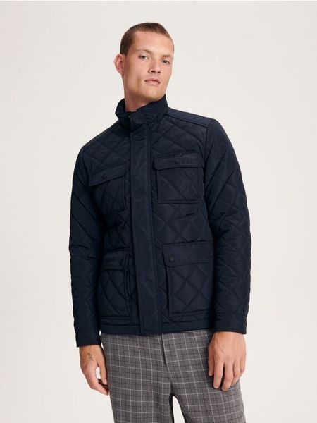 Kurtka pikowana - granatowy. Niebieskie kurtki męskie Reserved, l, bez wzorów, z tkaniny, bez kaptura. W wyprzedaży za 69.99 zł.