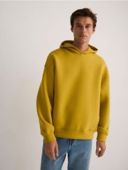 Gładka bluza z kapturem - żółty. Żółte bluzy z kapturem męskie Reserved, l, z bawełny. W wyprzedaży za 69.99 zł.