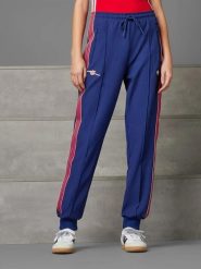 Adidas Spodnie dresowe w kolorze granatowym rozmiar: XL. Niebieskie spodnie dresowe damskie Adidas, xl, bez wzorów, z dresówki. Za 161.45 zł.