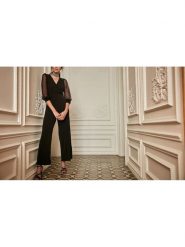 Milan Kiss Kombinezon w kolorze czarnym rozmiar: XL. Czarne kombinezony damskie Milan Kiss, xl, bez wzorów, bez kołnierzyka, bez ramiączek. Za 165.99 zł.