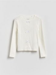 Koszulka z kokardkami - złamana biel. Koszulki dziewczęce Reserved, bez wzorów, z bawełny, bez ramiączek. Za 32.99 zł.