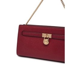 Torebka MICHAEL Michael Kors. Czerwone torebki wieczorowe MICHAEL Michael Kors, bez wzorów, wizytowe, bez kołnierzyka, bez ramiączek. Za 879.99 zł.