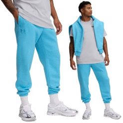 Spodnie dresowe męskie Under Armour joggery. Niebieskie spodnie dresowe męskie Under Armour, bez wzorów, z dresówki. W wyprzedaży za 240.25 zł.