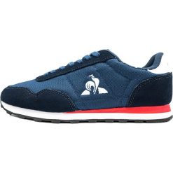 Buty sportowe unisex Astra dress blue. Niebieskie buty sportowe na co dzień męskie Le Coq Sportif, bez zapięcia. W wyprzedaży za 326.25 zł.