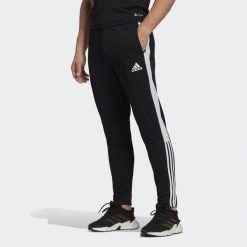 Spodnie adidas Tiro Essential, Mężczyźni. Czarne spodnie dresowe męskie Adidas, bez wzorów, z dresówki. Za 120.00 zł.