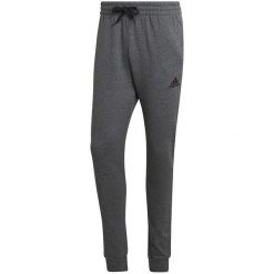 Spodnie męskie adidas Essentials Fleece Regular Tapered. Szare spodnie sportowe męskie Adidas. Za 182.00 zł.