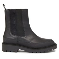 Sztyblety Calvin Klein Jeans. Czarne botki damskie Calvin Klein Jeans, z jeansu, bez obcasa, na płaskiej podeszwie, bez zapięcia. Za 679.99 zł.