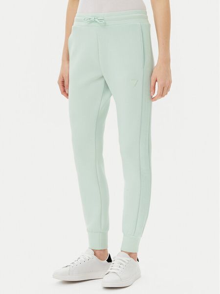 Guess Spodnie dresowe V2YB18 K7UW2 Zielony Regular Fit. Zielone spodnie dresowe damskie Guess, s, z aplikacjami, z dresówki. Za 209.99 zł.