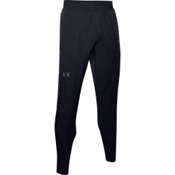 Spodnie dresowe slim fit Under Armour Flex Woven. Czarne spodnie sportowe męskie Under Armour, z dresówki. Za 375.00 zł.