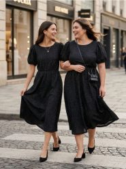 Dzianinowa sukienka midi z ażurowym wzorem i metalizowaną nicią - czarny. Czarne sukienki damskie Sinsay, l, w ażurowe wzory, z dzianiny, bez kołnierzyka, bez ramiączek, midi. Za 69.99 zł.