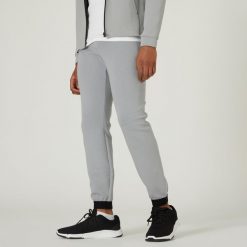 Spodnie dresowe męskie Nyamba Gym & Pilates 540 slim. Szare spodnie dresowe męskie DOMYOS, z bawełny. W wyprzedaży za 89.99 zł.