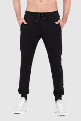DOLCE & GABBANA Czarne spodnie dresowe z haftowanym logo. Czarne spodnie dresowe męskie Dolce and Gabbana, bez wzorów, z bawełny. W wyprzedaży za 2,349.99 zł.