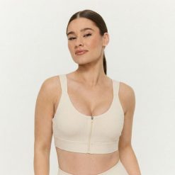 Biustonosz sportowy damski z zamkiem Prime Pearl. Białe biustonosze sportowe damskie GYMBEAM, bez wzorów, z elastanu. Za 100.90 zł.