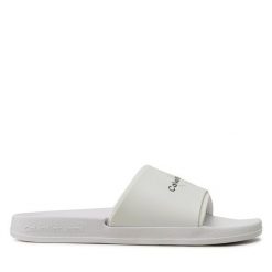 Klapki Calvin Klein Jeans. Białe klapki damskie Calvin Klein Jeans, bez wzorów, z jeansu, bez obcasa. Za 229.99 zł.