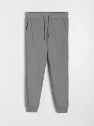 Spodnie jogger dresowe pique - szary. Szare spodnie sportowe męskie Sinsay, z dresówki. W wyprzedaży za 25.99 zł.