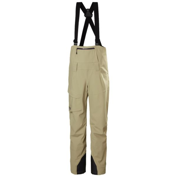 Kombinezon narciarski damski z szelkami Helly Hansen Verglas BC. Brązowe kombinezony damskie Helly Hansen, na zimę, bez wzorów, sportowe, bez kołnierzyka, bez ramiączek. W wyprzedaży za 1,039.20 zł.