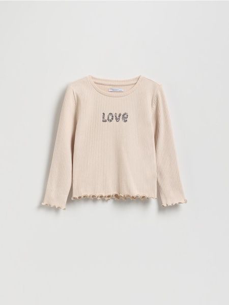 Prążkowana koszulka z nadrukiem - kremowy. Białe koszulki dziewczęce Reserved, m, bez wzorów, z bawełny, bez ramiączek. W wyprzedaży za 25.99 zł.