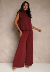 Bordowy Komplet Spodnie o Szerokim Kroju i Bluzka Ozdobiona Wiązaniem Halomia. Czerwone spodnie materiałowe damskie Renee, bez wzorów, eleganckie. Za 189.99 zł.