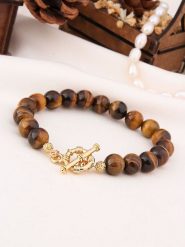 L'Atelier de Gaia Pozłacana bransoletka z tygrysim okiem rozmiar: onesize. Brązowe bransoletki damskie L'Atelier de Gaia, pozłacane. Za 43.99 zł.