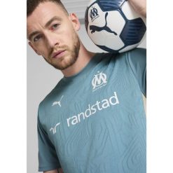 Męska koszulka treningowa Olympique Marsylia PUMA Bold Blue Putty Beige. Brązowe t-shirty sportowe męskie Puma, l, bez ramiączek, do piłki nożnej. Za 254.00 zł.