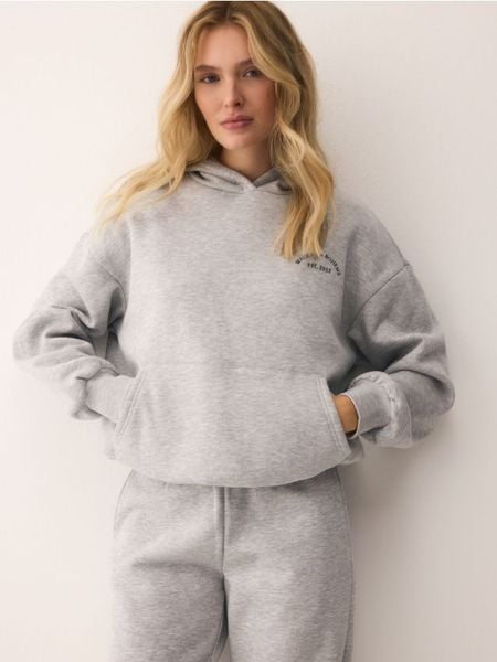 Bluza oversize z kapturem - jasnoszary. Szare bluzy z kapturem damskie Reserved, l, z bawełny. W wyprzedaży za 89.99 zł.
