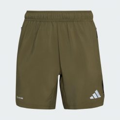 SZORTY TECH APPAREL. Brązowe szorty męskie Adidas, bez wzorów, z materiału, klasyczne. Za 129.00 zł.