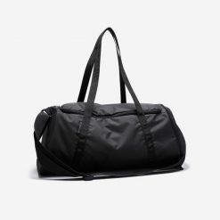 Torba fitness Domyos 20 l. Czarne torby sportowe damskie DOMYOS, bez wzorów, z materiału, bez dodatków. W wyprzedaży za 39.99 zł.