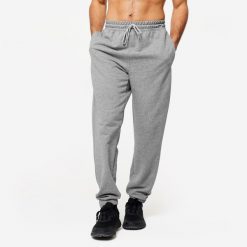 Spodnie fitness męskie Domyos Gym & Pilates. Szare spodnie dresowe męskie DOMYOS, z bawełny. Za 99.99 zł.