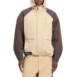 Kurtka REEBOK UTILITY SHELL JACKE Brązowy. Brązowe kurtki damskie Reebok, bez wzorów, z tkaniny, bez kaptura. Za 598.99 zł.