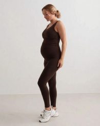 Damskie legginsy ciążowe, z wysokim stanem, squat proof Sense czekoladowe. Brązowe legginsy sportowe damskie Aim'n, xl, bez wzorów, z elastanu, z podwyższonym stanem, na fitness i siłownię. Za 301.00 zł.