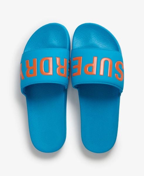 Superdry Klapki Pool z wyściełanym paskiem i formowaną wkładką – Atomic Blue. Niebieskie klapki i japonki męskie Superdry., z poliesteru. Za 129.00 zł.