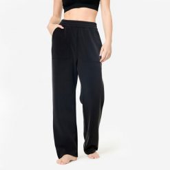 Spodnie do jogi damskie Domyos. Czarne spodnie materiałowe damskie DOMYOS, bez wzorów, z materiału, eleganckie. Za 129.99 zł.