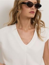 Bluza bez rękawów soft touch - kremowy. Białe bluzy bez kaptura damskie Sinsay, l, z dzianiny. Za 39.99 zł.