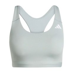 Biustonosz dla kobiet adidas Optime Essentials. Zielone biustonosze sportowe damskie Adidas, bez wzorów, z lycry. Za 171.50 zł.