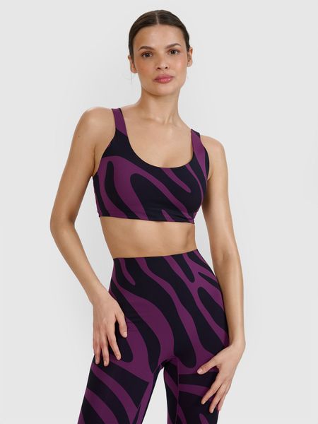 4F Biustonosz do jogi i pilatesu ze średnim wsparciem - fioletowy L. Fioletowe biustonosze sportowe damskie 4f, bez wzorów, z dzianiny. W wyprzedaży za 59.99 zł.