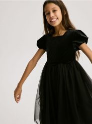 Sukienka z łączonych materiałów - czarny. Czarne sukienki dziewczęce Reserved, bez wzorów, z materiału, bez ramiączek. Za 99.99 zł.