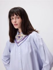 Koszula z marszczeniem - jasnoniebieski. Niebieskie koszule damskie Reserved, l, bez wzorów, z bawełny, bez kołnierzyka, bez ramiączek. Za 179.99 zł.