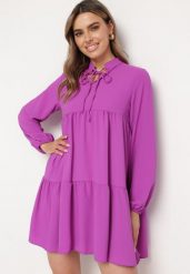 Fioletowa Rozkloszowana Sukienka z Falbanką Uxaria. Fioletowe sukienki damskie Born2be, uniwersalny, z aplikacjami, eleganckie, bez kołnierzyka, bez ramiączek, mini, rozkloszowane. Za 99.99 zł.