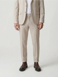 Garniturowe spodnie w kant - beżowy. Brązowe spodnie wizytowe męskie Reserved, z tkaniny. Za 169.99 zł.