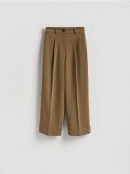 Spodnie culotte - oliwkowy. Zielone spodnie materiałowe damskie Reserved, bez wzorów, z tkaniny. Za 159.99 zł.