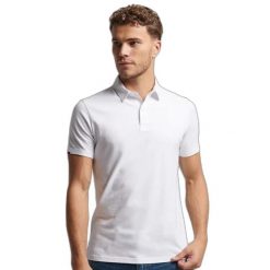 Koszulka polo z dżerseju Superdry Studios. Białe koszulki polo męskie Superdry., xl, bez wzorów, z bawełny, bez ramiączek. Za 223.90 zł.