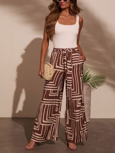 Milan Kiss Spodnie w kolorze brązowo-kremowym rozmiar: XL. Brązowe spodnie materiałowe damskie Milan Kiss, bez wzorów, z materiału. Za 143.90 zł.