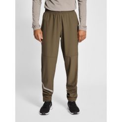 Spodnie do biegania Newline Portland. Brązowe spodnie sportowe męskie Newline, z dresówki. Za 282.50 zł.