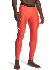 Under Armour Legginsy sportowe "HG Armour" w kolorze pomarańczowym rozmiar: L. Pomarańczowe spodnie sportowe męskie Under Armour, z materiału. Za 138.38 zł.